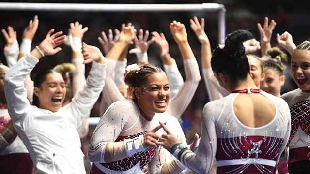 Alabama gymnast Makarri Doggette congratulates Alabama gymnast Luisa Blanco after Blanco s bars routine at Coleman Coliseum